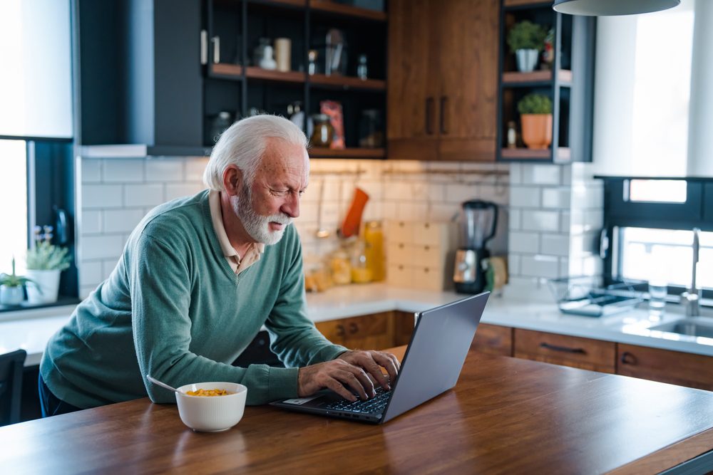Senior,Man,Working,At,Laptop,At,Home.,Retired,Man,On