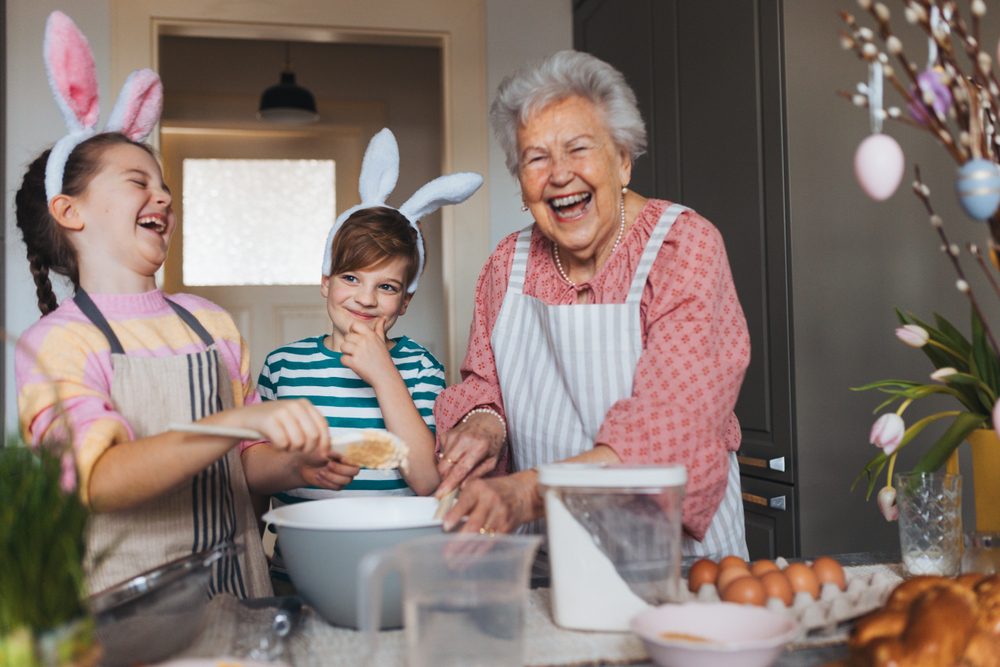 Grandmother,With,Grandchildren,Preparing,Traditional,Easter,Meals,,Baking,Cakes,And